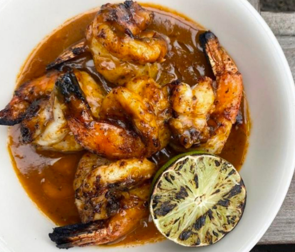 Atlanta’s King + Duke restaurant uses a brown butter hot sauce to create a flavor bomb for a shrimp.