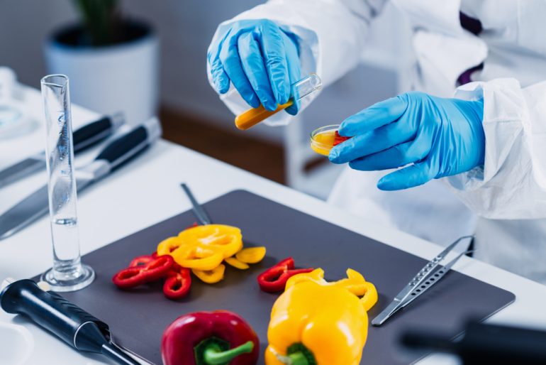 Food safety, vegetables Quality control food safety inspector working in a laboratory