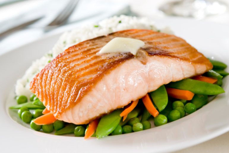 Closeup of pan seared salmon on vegetables. Selective focus; shallow depth of field.Related Images: